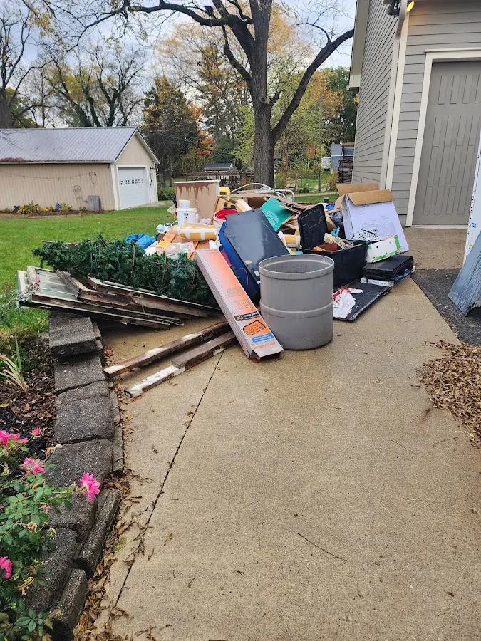 Dumpster being loaded with debris for 30 Yard Dumpster Rental in Felida